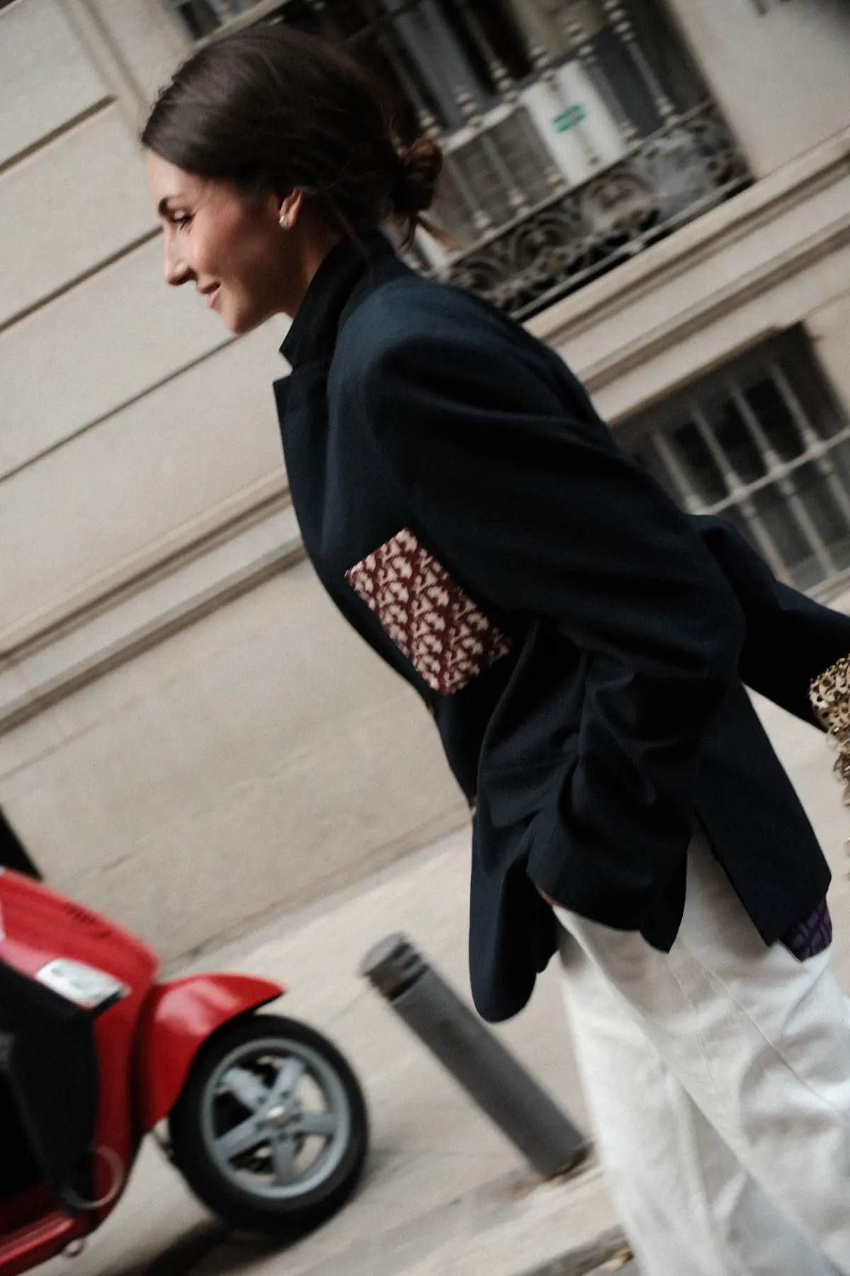 Parché Studio jeans with purple monogram patch pockets, worn on a Madrid street
